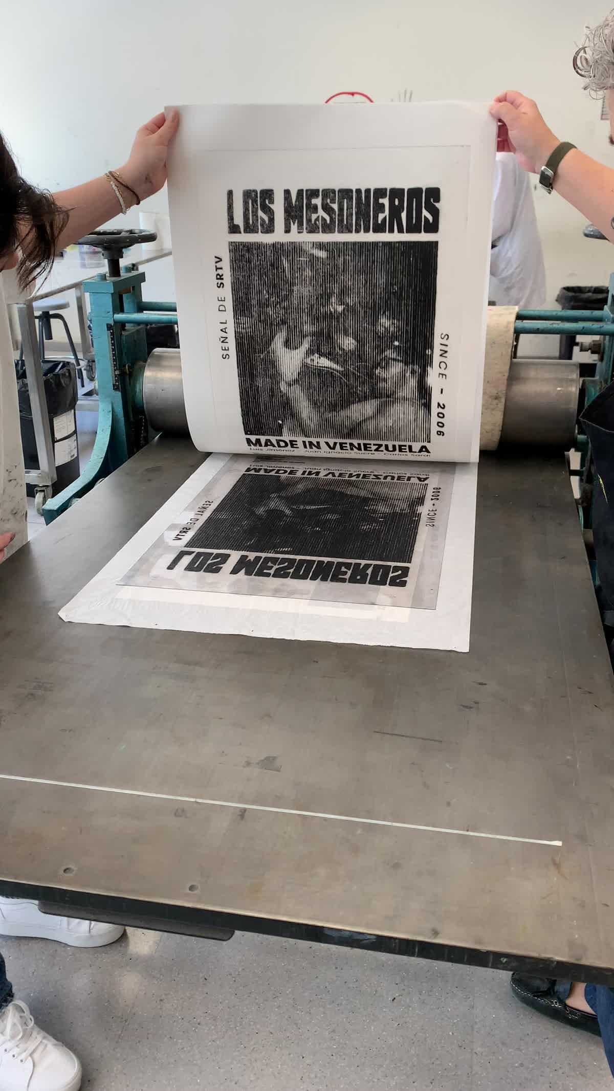 Inking the acetate plate in the printmaking workshop