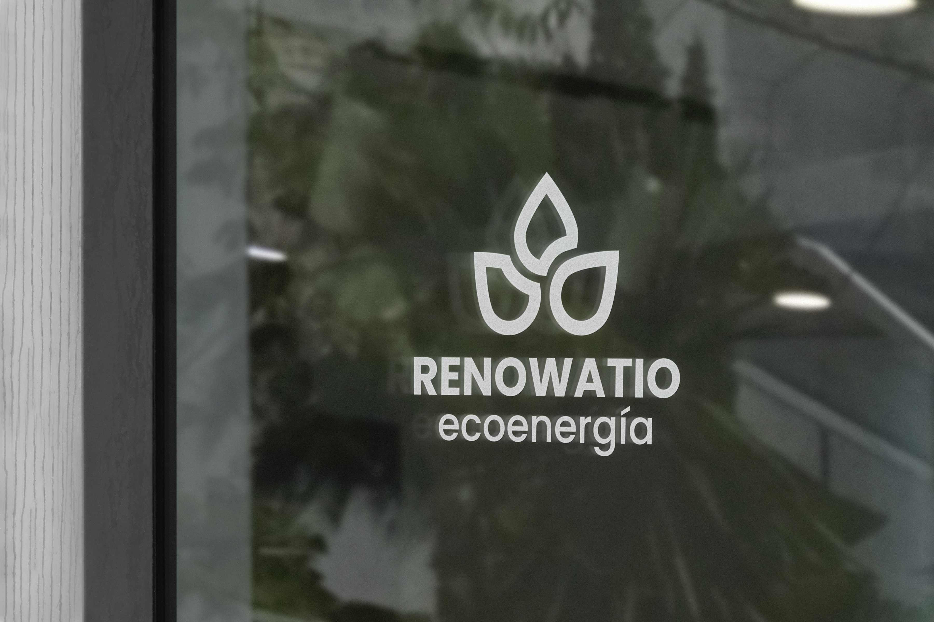 Building entrance signage with the Renowatio logotype and mark